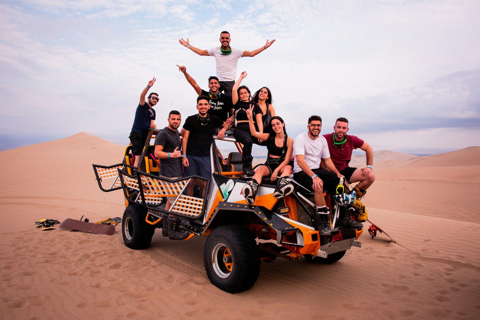 a group of people riding on the back of a four wheeler